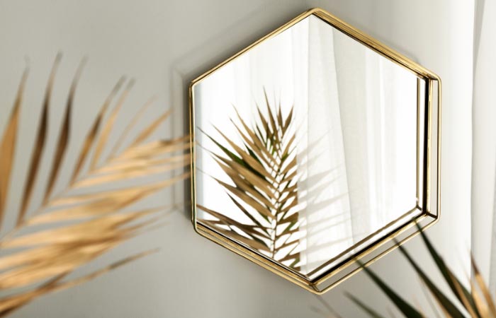 How do you style a living room with a mirror?