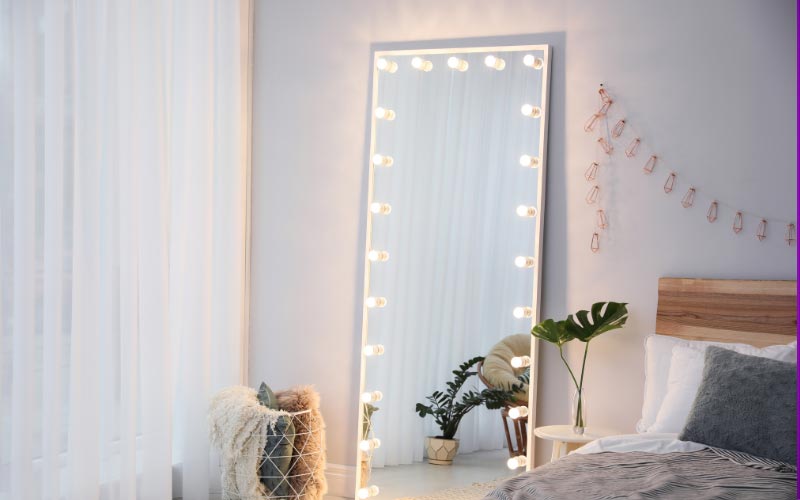 small bedroom with mirrors