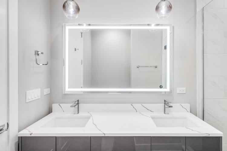 How much space should be between vanity light and mirror 