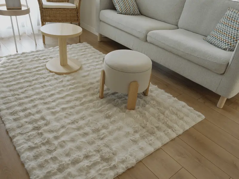 Choose larger rugs that extend under furniture.
